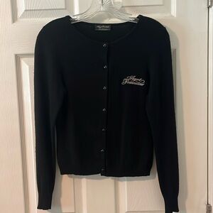 Agent Provocateur “shopgirl” uniform cardigan.